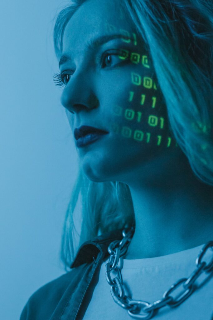 Close-up of a face overlaid with binary code, symbolizing algorithmic bias in AI facial and pattern recognition